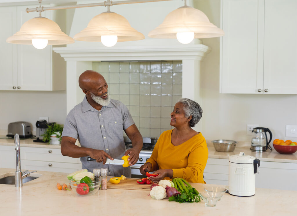 African American couple preparing a meal in their kitchen