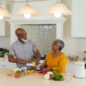 African American couple preparing a meal in their kitchen